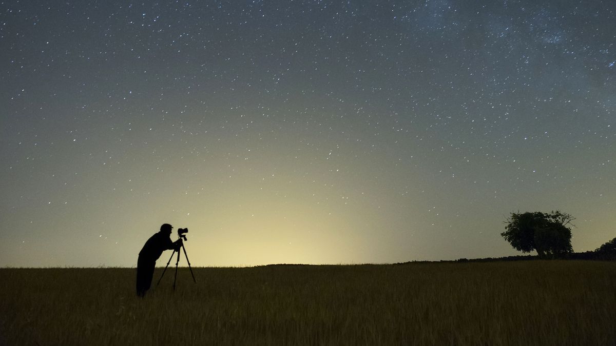 Astrophotography competitions: Image shows person taking photo of night sky