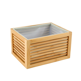 a wooden basket for storage lined with white fabric