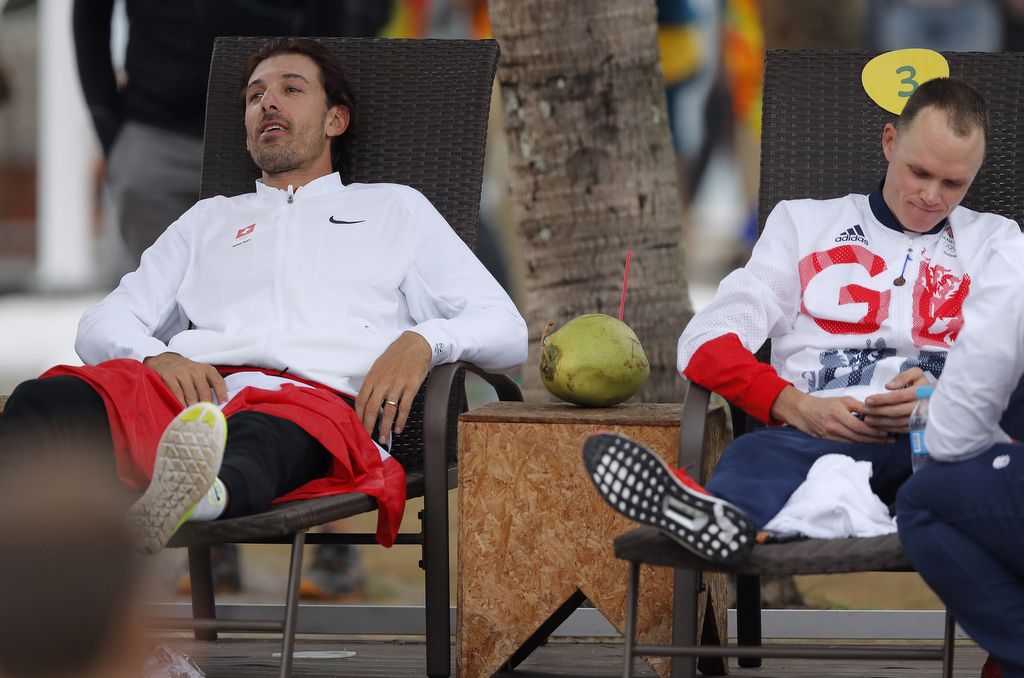 Fabian Cancellara and Chris Froome (Great Britain) recline before the podium ceremony