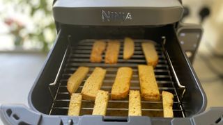 Tofu being cooked in the Ninja DoubleStack Air Fryer