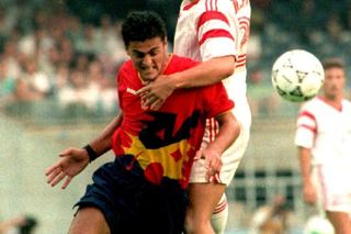 Spain's Luis Enrique competes for the ball with a Poland player at the 1992 Olympics in Barcelona.
