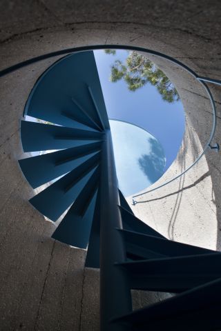Blue spiral staircase from below