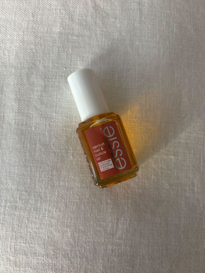 The Essie Nail Care Apricot Cuticle Oil on a white background
