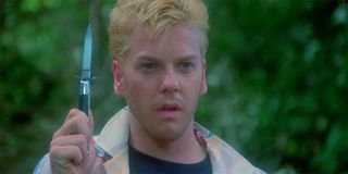 Kiefer Sutherland as Ace holding a knife in Stand By Me