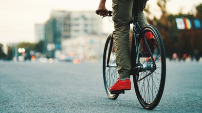 Male cyclist wearing some of the best bicycle commuter pants / trousers