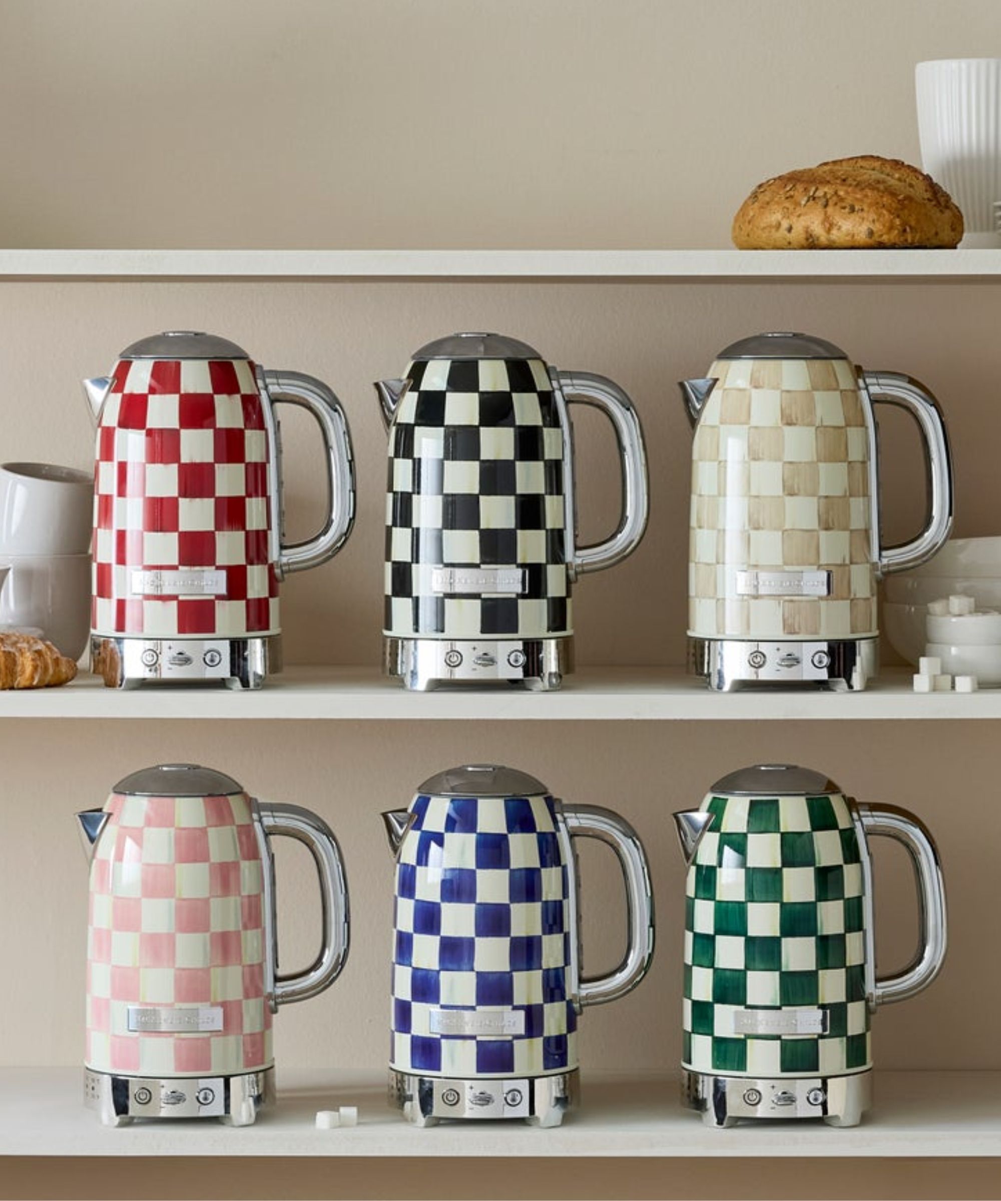Electric kettles in blue, black, pink, green and pale brown checkerboard patterns