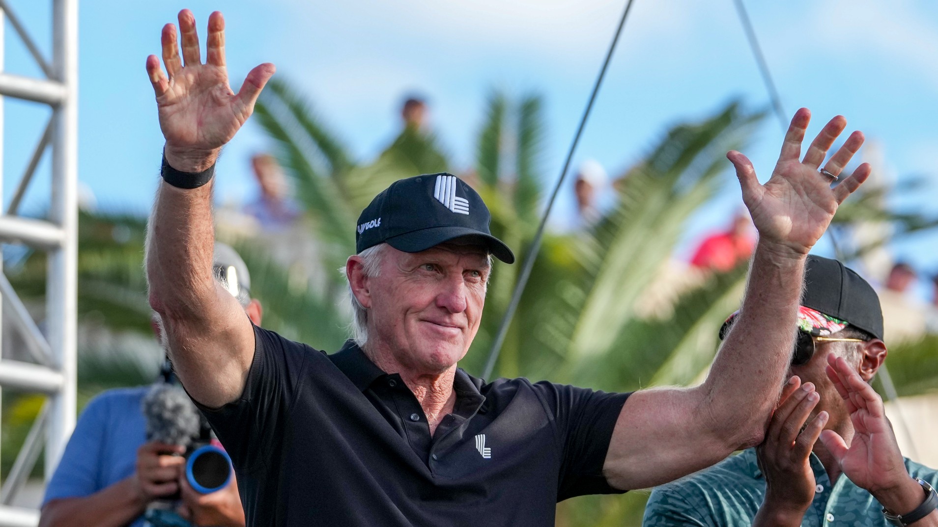 Greg Norman and players line up on the stage during the LIV Golf