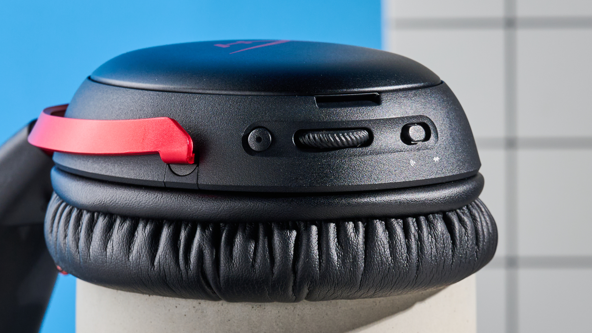 A black and red HyperX Cloud III S Wireless gaming headset