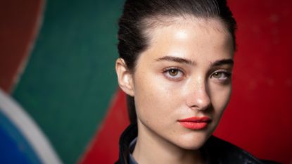 girl wearing red lipstick with strong eyebrows