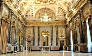 The Napoleonic room posed as a grand backdrop for Dundas' astrologically inspired collection, with its gold plating and crystal chandeliers shedding a glistening glow on all below