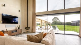 SUNFLEXUK SVG20 Sliding Doors looking out onto garden from a contemporary styled living space 