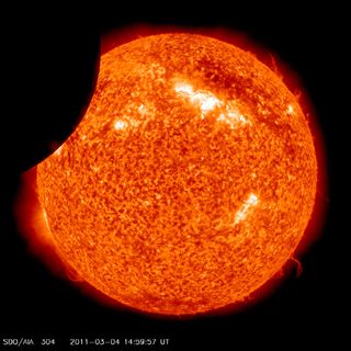 NASA's SDO satellite photographed the moon passing in front of the sun, March 2-4, 2011.