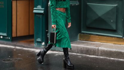 A guest in green skirt outside Dior SS24 GettyImages-1501788299