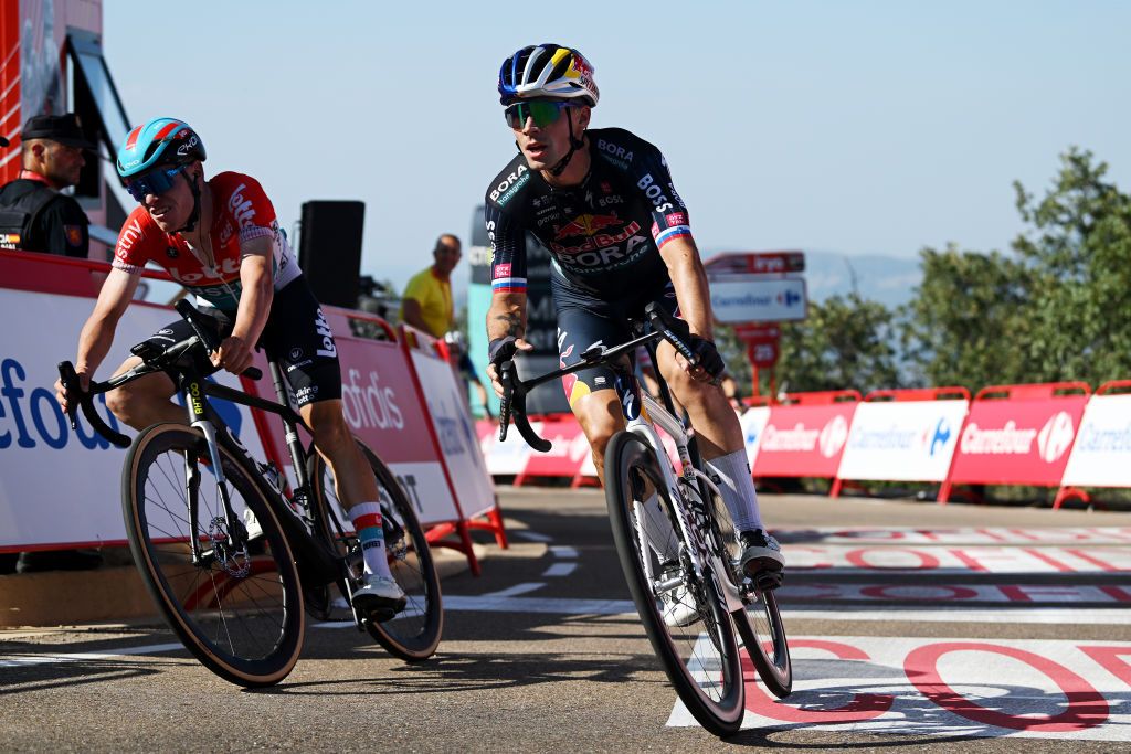 PICO VILLUERCAS SPAIN AUGUST 20 Primoz Roglic of Slovenia and Team Red Bull Bora hansgrohe R crosses the finish line as stage winner ahead of Lennert Van Eetvelt of Belgium and Team Lotto Dstny L during the La Vuelta 79th Tour of Spain 2024 Stage 4 a 1705km stage from Plasencia to Pico Villuercas 1544m UCIWT on August 20 2024 in Pico Villuercas Spain Photo by Dario BelingheriGetty Images