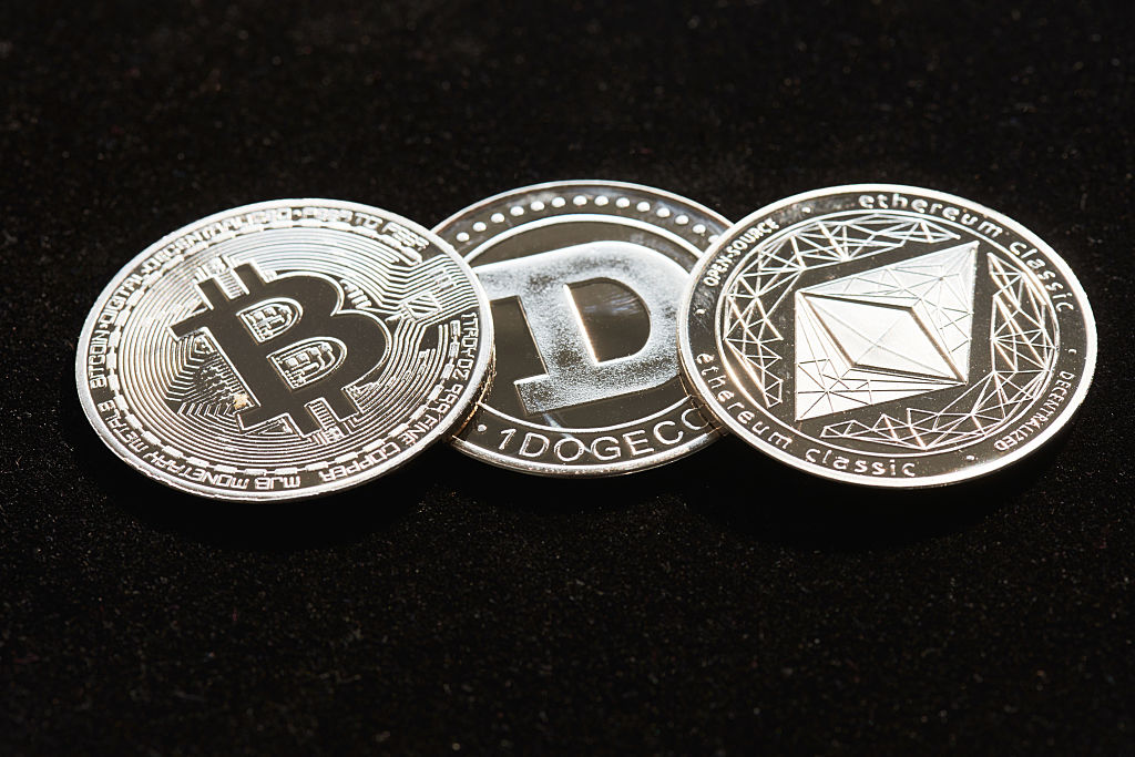 Illustration of bitcoin, ethereum cryptocurrency coins representing crypto ETNs