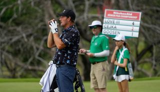 Alex Cejka measures a target during the first round of the KitchenAid Senior PGA Championship