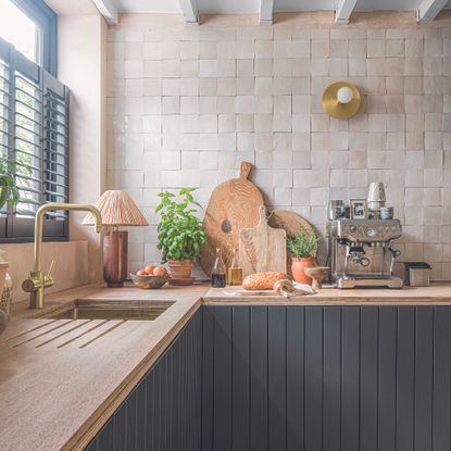 Kitchen with lots of accessories on worktop