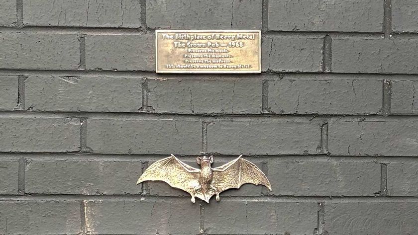 The brass plaque and bat attached to the wall of The Crown, Birmingham