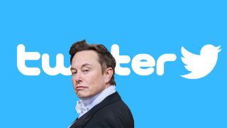 Elon Musk in front of the Twitter logo