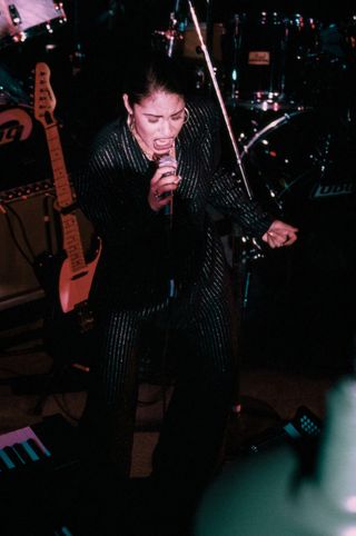 Selena (Quintanilla) performs at the opening of the Hard Rock Cafe on January 12th, 1995 in San Antonio, Texas.