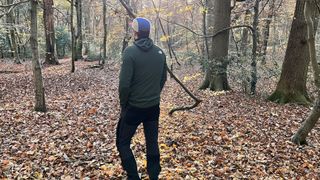 Man wearing The North Face Summit Series Futurefleece jacket in a forest – back view