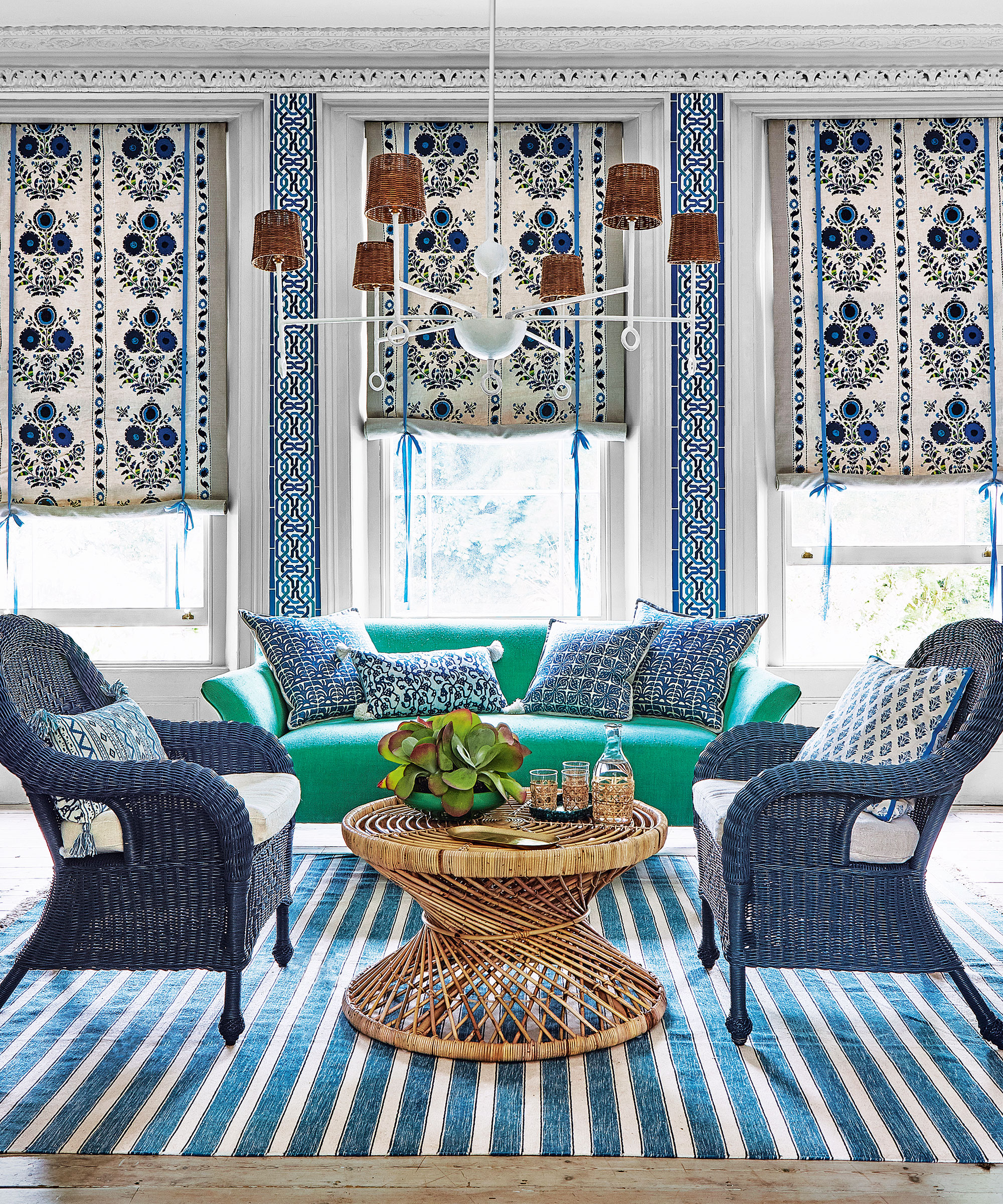 Light living room with rattan table and chairs and patterned blinds