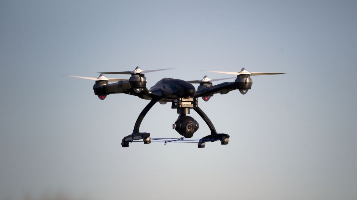 Where can I fly my drone: Image shows drone against blue sky backdrop