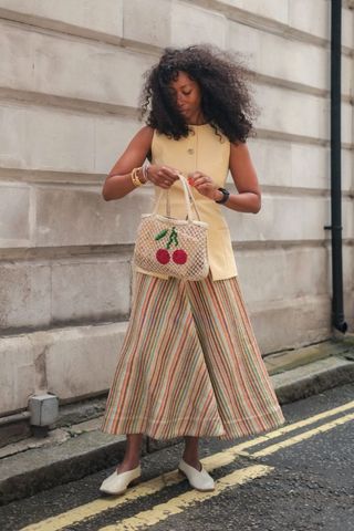 Thandi Maqubela wearing a cherry bag