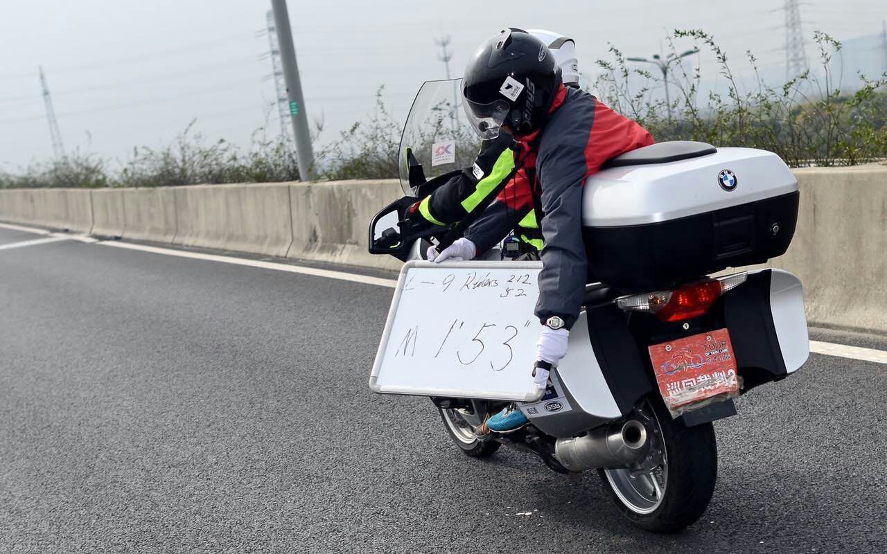 The breakaway riders are informed of the time gap