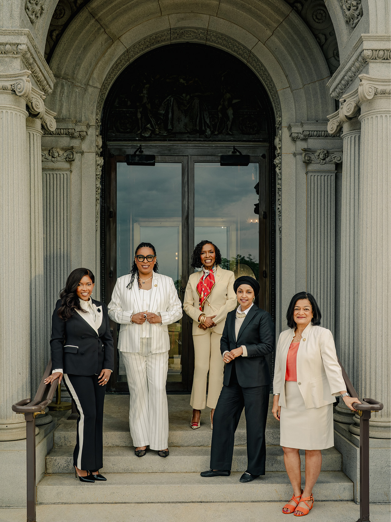 Five congresswomen stand in the arched doorway of the Library of Congress. From left: Jasmine Crockett, LaMonica McIver, Yvette Clarke, Ilhan Omar, and Pramila Jayapal.