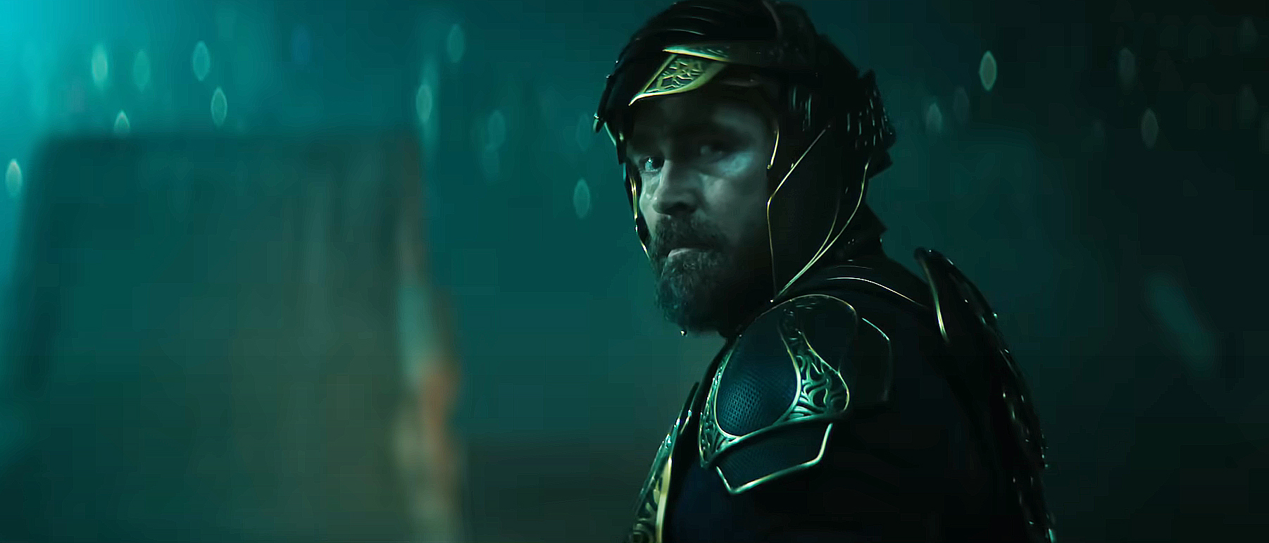An armored Brother Day looking over his left shoulder at night in Foundation season 3