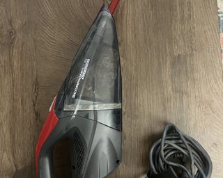 Image of Dirt Devil handheld vacuum with full tank