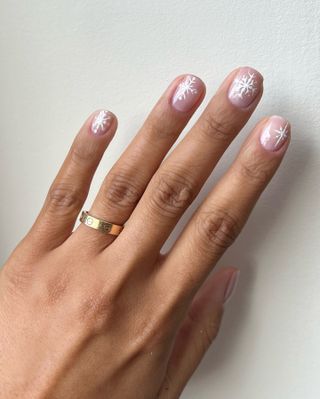 Small snowflake manicure by Iram Shelton