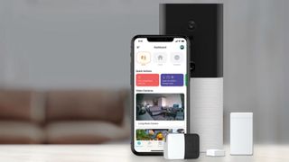 Abode Business displayed on iPhone next to other smart devices