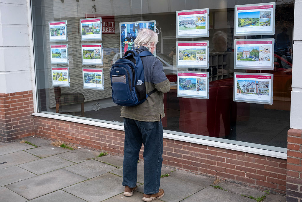 Man looking into the window of an estate agent on 29th October 2025 in Shrewsbury, United Kingdom