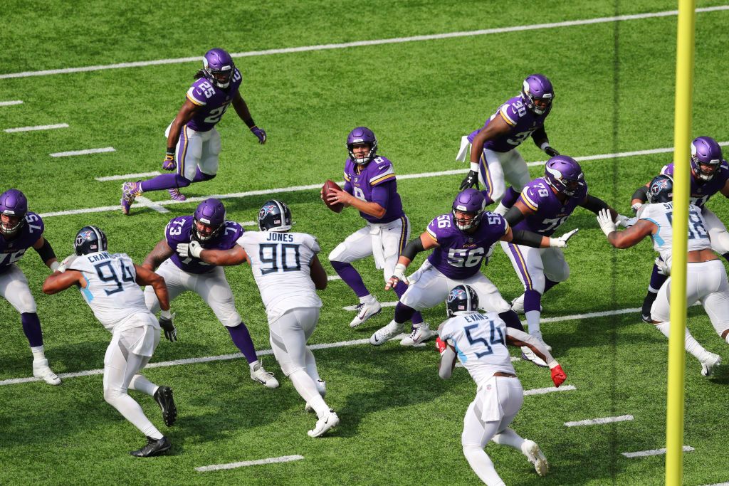 Kirk Cousins #8 of the Minnesota Vikings drops back against the Tennessee Titans in the fourth quarter at U.S. Bank Stadium on September 27, 2020 in Minneapolis, Minnesota.