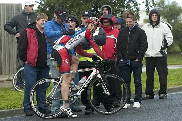 Attracting a crowd: Patrick Shaw (Virgin Blue/RBS Morgans) struck back wheel trouble and received a lap-out but found plenty of friends whilst waiting for the peloton.