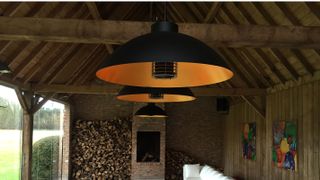 garden room with huge pendant light heaters over table