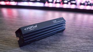 Crucial T705 NVMe SSD on a desk.