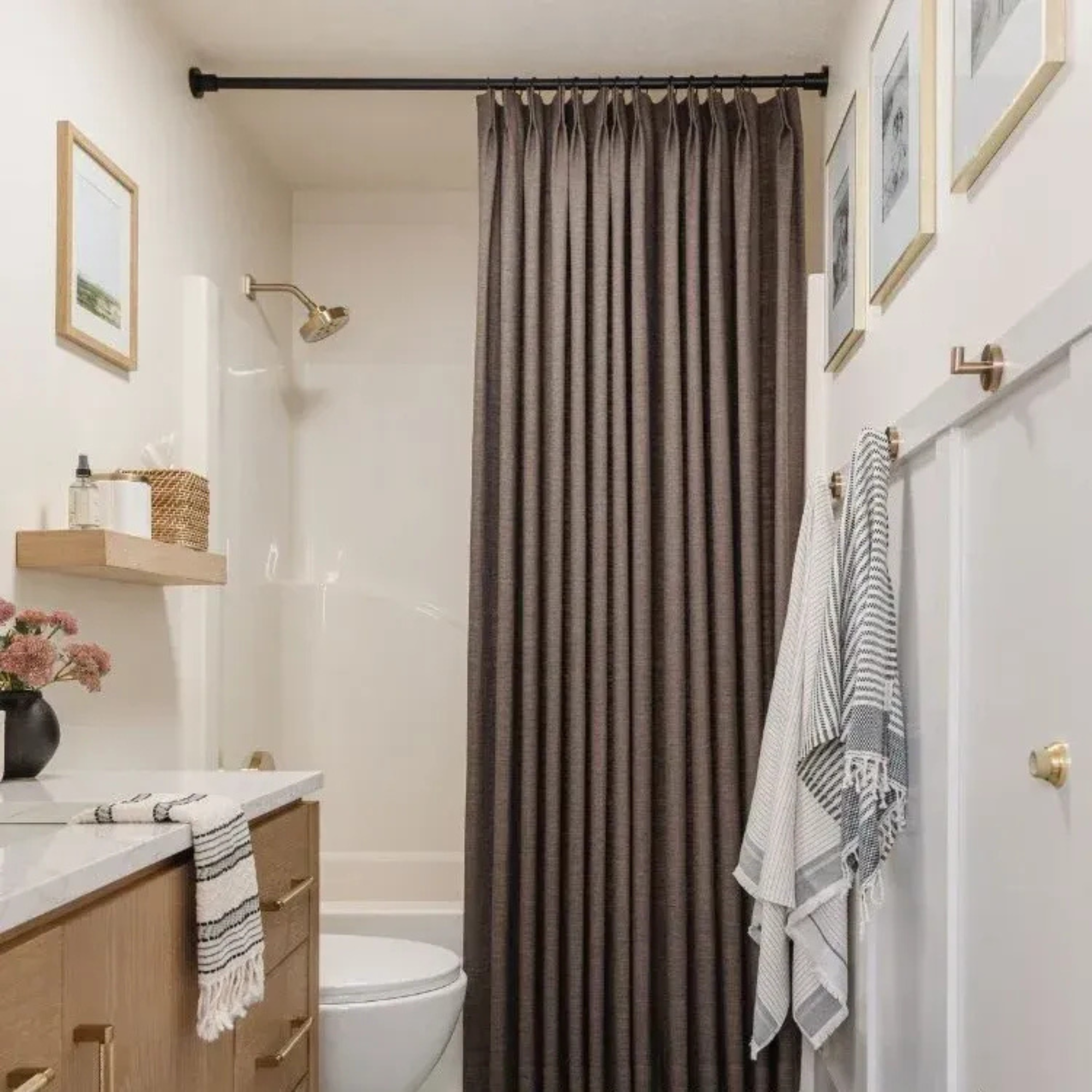 a bathroom with a tall brown shower curtain