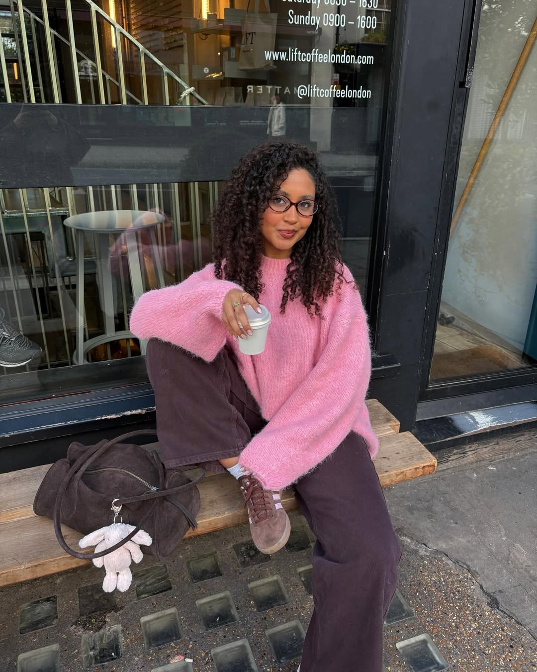 Layla in pink jumper and brown jeans