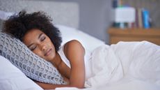 Cropped shot of a young woman asleep on her side.
