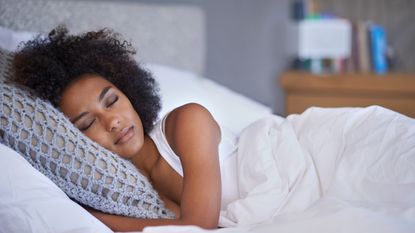 Cropped shot of a young woman asleep on her side.