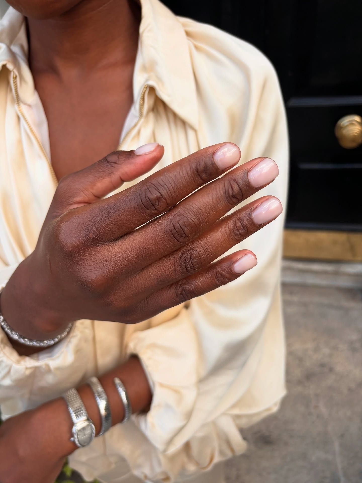 Short nails with a sheer milky white nail colour