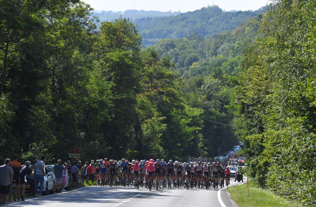 BILZEN BELGIUM SEPTEMBER 03 A general view of the peloton compete during the 17th Benelux Tour 2021 Stage 5 a 188km stage from Riemst to Bilzen BeneluxTour on September 03 2021 in Bilzen Belgium Photo by Luc ClaessenGetty Images