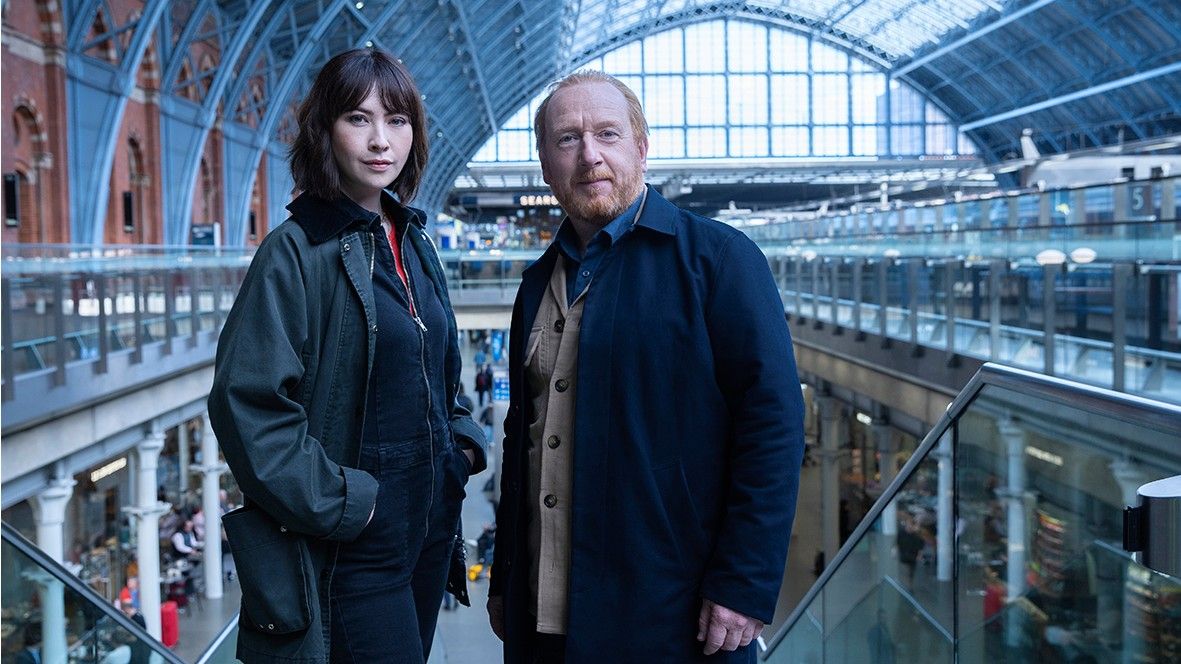 Max and Layla in a train station in The Chelsea Detective Season 2