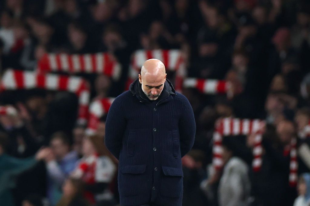 Pep Guardiola, Manager of Manchester City, looks dejected during the Premier League match between Arsenal FC and Manchester City FC at Emirates Stadium on February 02, 2025 in London, England. 