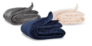 three weighted blankets in grey, blue and beige.