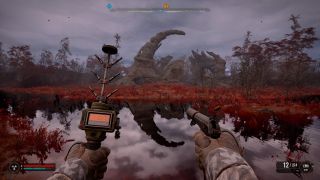 The player wields a pistol and artifact detector while looking at a strange stone pyre over a blood-red pond.