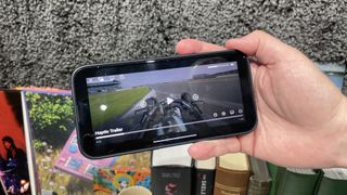 F1 the Movie haptic trailer paused on an iPhone screen